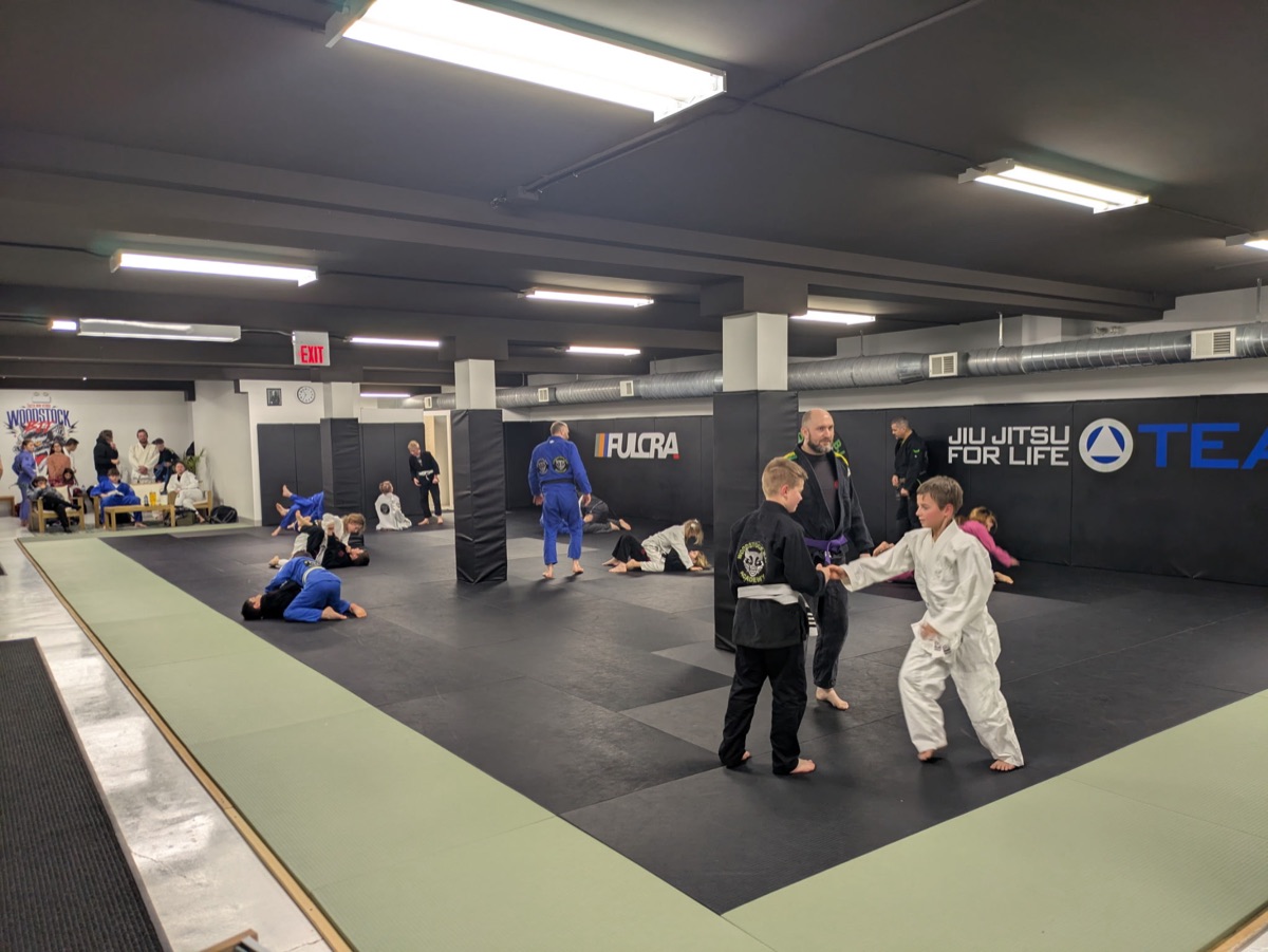 Students warming up at Woodstock BJJ